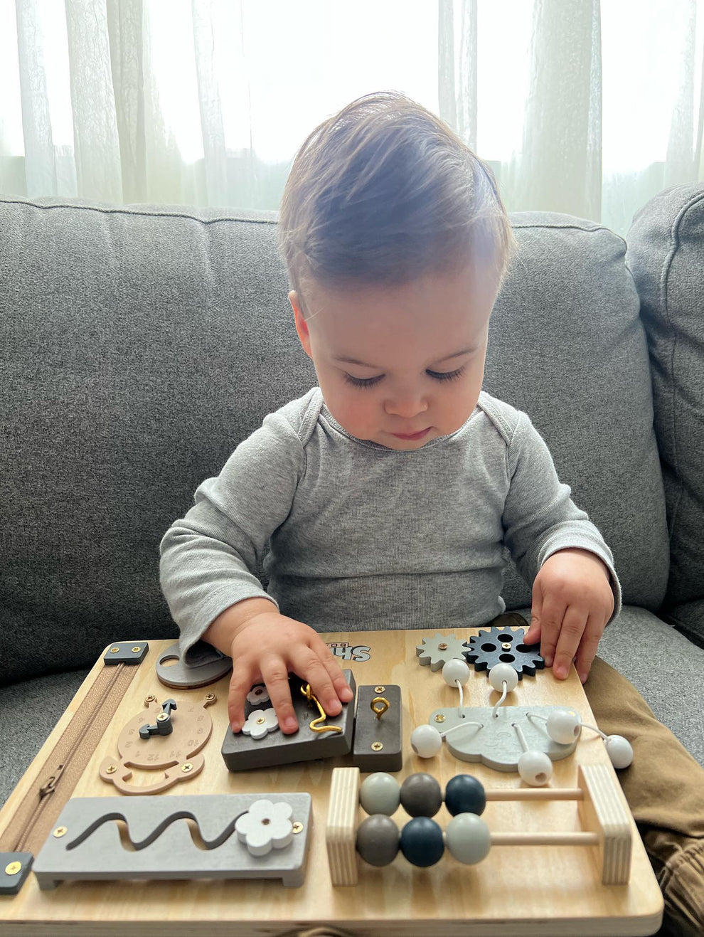 Toddler interacting with the Shiloh Board.